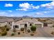 Charming single-story home with a well-manicured front yard and a circular driveway at 1319 N Chatsworth St, Mesa, AZ 85207