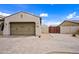 Garage and gated side yard featuring a brick driveway and elegant design at 1319 N Chatsworth St, Mesa, AZ 85207