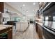 Open kitchen layout with stainless steel appliances, an island, and easy access to the living area at 1319 N Chatsworth St, Mesa, AZ 85207