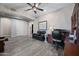Cozy living room with ceiling fan and tile flooring at 1319 N Chatsworth St, Mesa, AZ 85207