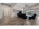 Open living room featuring tile floors and access to the outdoor space at 1319 N Chatsworth St, Mesa, AZ 85207