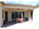 Covered patio with ceiling fan and outdoor dining set at 1319 N Chatsworth St, Mesa, AZ 85207