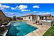 Inviting backyard featuring a sparkling pool and a hot tub, perfect for relaxing and entertaining outdoors at 1319 N Chatsworth St, Mesa, AZ 85207