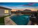 Inviting pool featuring a built-in waterfall and a relaxing spa area in a private backyard at 1319 N Chatsworth St, Mesa, AZ 85207