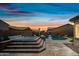 Stunning backyard with a stone patio featuring a hot tub and refreshing swimming pool at 1319 N Chatsworth St, Mesa, AZ 85207