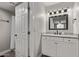Modern bathroom featuring a framed mirror, modern vanity, and a shower with a curtain rod at 1340 N Recker Rd # 118, Mesa, AZ 85205
