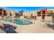Community pool area with lounge chairs, ideal for summertime relaxation and recreation at 1340 N Recker Rd # 118, Mesa, AZ 85205