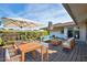 Outdoor patio featuring lounge furniture, a large dining table, and umbrella at 13410 N Cedar Dr, Sun City, AZ 85351
