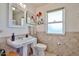 Bathroom with decorative accents, featuring a pedestal sink and decorative tile at 13410 N Cedar Dr, Sun City, AZ 85351