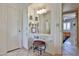 Bathroom vanity area with seating, storage, bright lighting, and convenient access at 13410 N Cedar Dr, Sun City, AZ 85351