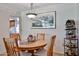 Cozy dining area features a round table, classic chandelier, and decorative accents for inviting meals at 13410 N Cedar Dr, Sun City, AZ 85351