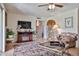 Living room showcasing a decorative rug, fireplace, and comfortable seating, perfect for relaxation at 13410 N Cedar Dr, Sun City, AZ 85351