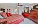 Relaxing main bedroom featuring a comfortable bed, ample dresser storage, and neutral decor at 13410 N Cedar Dr, Sun City, AZ 85351