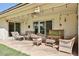 Outdoor patio with stone flooring, string lights and assorted seating at 13410 N Cedar Dr, Sun City, AZ 85351