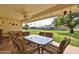 Covered patio with ample seating and ceiling fan overlooking the yard at 13410 N Cedar Dr, Sun City, AZ 85351