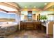 Bathroom with a soaking tub and mountain views, and double sink vanity with wood cabinets at 14426 N Vista Del Oro --, Scottsdale, AZ 85264