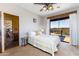 Cozy bedroom with a ceiling fan, carpet flooring, and glass door leading to an outdoor space at 14426 N Vista Del Oro --, Scottsdale, AZ 85264