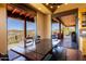 Dining room with access to the patio, wooden table, bench, and chairs for seating at 14426 N Vista Del Oro --, Scottsdale, AZ 85264