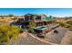 Exterior shot of the house showcasing the pool, outdoor kitchen, and multiple covered patio spaces at 14426 N Vista Del Oro --, Scottsdale, AZ 85264