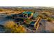 Exterior elevation of home with a green roof and patio with pool nestled into desert landscape at 14426 N Vista Del Oro --, Scottsdale, AZ 85264