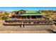 Desert home with a green metal roof, a deck and patio, a swimming pool, and mountain views at 14426 N Vista Del Oro --, Scottsdale, AZ 85264