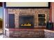 Stone fireplace with mantel and media components adding ambiance to the home at 14426 N Vista Del Oro --, Scottsdale, AZ 85264