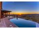 Relax by the infinity pool and enjoy breathtaking sunset mountain views from the patio at 14426 N Vista Del Oro --, Scottsdale, AZ 85264