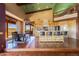 Bright kitchen with wood cabinets, granite counters, stainless steel appliances, island, and a dining area at 14426 N Vista Del Oro --, Scottsdale, AZ 85264