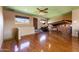 Spacious living room featuring a hardwood floor, high ceilings, exposed beams, and large windows at 14426 N Vista Del Oro --, Scottsdale, AZ 85264
