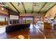 Spacious living room featuring a fireplace, wood floors, and open access to the kitchen and outdoor views at 14426 N Vista Del Oro --, Scottsdale, AZ 85264