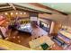 Open living room with high ceilings, wood floors, fireplace, and expansive windows showcasing the scenery at 14426 N Vista Del Oro --, Scottsdale, AZ 85264