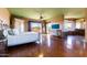 Bright bedroom featuring hardwood floors, a ceiling fan, and an ensuite bathroom at 14426 N Vista Del Oro --, Scottsdale, AZ 85264
