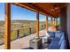 Outdoor patio with wood beam ceiling, mountain views, tile flooring, and cozy seating area at 14426 N Vista Del Oro --, Scottsdale, AZ 85264