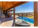 Beautiful infinity pool with an adjacent outdoor kitchen and expansive views of the surrounding desert landscape at 14426 N Vista Del Oro --, Scottsdale, AZ 85264