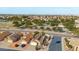 Expansive aerial view showcases the home's neighborhood and the surrounding area with desert landscaping at 15002 W Heritage Oak Way, Surprise, AZ 85374