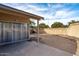 Backyard featuring a patio, block fence, and desert landscaping at 15002 W Heritage Oak Way, Surprise, AZ 85374