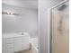 Bathroom featuring a shower, bathtub, white cabinets, and neutral colored walls at 15002 W Heritage Oak Way, Surprise, AZ 85374