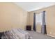 Bedroom with neutral-colored walls, carpet flooring, and a window at 15002 W Heritage Oak Way, Surprise, AZ 85374