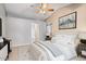 A bedroom with white walls and neutral decor with a ceiling fan and carpet flooring at 15002 W Heritage Oak Way, Surprise, AZ 85374