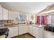 Functional kitchen with white cabinetry and an eat-in area perfect for casual dining at 15002 W Heritage Oak Way, Surprise, AZ 85374