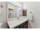 Bathroom features a modern vanity with white countertop and a mirror reflecting the shower at 15095 N Thompson Peak Pkwy # 1053, Scottsdale, AZ 85260