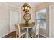 Charming dining area with stylish lighting fixture and a round table, perfect for casual dining and entertaining at 15095 N Thompson Peak Pkwy # 1053, Scottsdale, AZ 85260