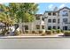 Exterior view of a multi-story apartment building with manicured landscaping at 15095 N Thompson Peak Pkwy # 1053, Scottsdale, AZ 85260
