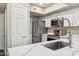 Well-organized kitchen with stainless steel appliances, white cabinets, and plenty of counter space, offering functionality at 15095 N Thompson Peak Pkwy # 1053, Scottsdale, AZ 85260