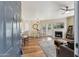 Inviting living room with hardwood floors, a fireplace, comfortable seating, and natural light, creating a cozy atmosphere at 15095 N Thompson Peak Pkwy # 1053, Scottsdale, AZ 85260