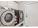 Laundry room features modern stainless steel washer and dryer, plus storage cabinets at 16014 S 13Th Way, Phoenix, AZ 85048