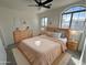 Bright bedroom featuring neutral tones, multiple windows and contemporary furnishings at 1698 E Barbarita Ave, Gilbert, AZ 85234