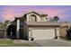 Charming two-story home featuring a desert landscape, tile roof, and a two-car garage at 1698 E Barbarita Ave, Gilbert, AZ 85234