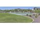 Community basketball court offers a full court with hoops and ample playing space at 17157 W Oberlin Way, Surprise, AZ 85387
