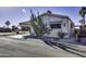 Charming single-story home featuring a covered carport and xeriscaped landscaping with a large cactus at 17200 W Bell Rd # 1551, Surprise, AZ 85374